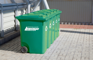 a row of green garbage cans from lepage avisons