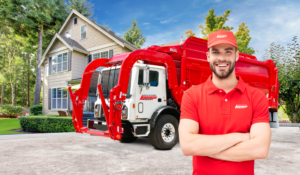 a man standing in front of a garbage truck that says kenmore